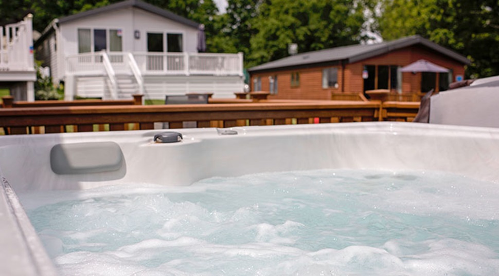 A lodge hot tub with a view of other lodges