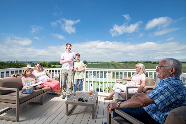 A family sat on their veranda at Todber Valley Holiday Park