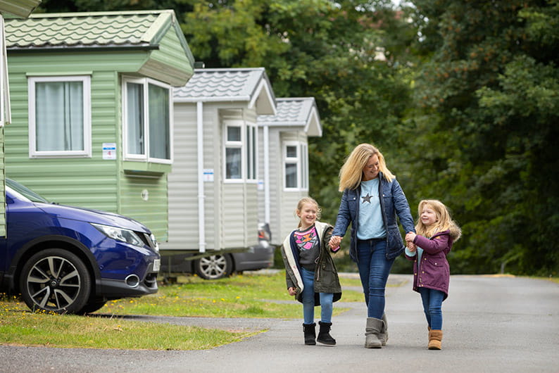 Family next to caravans