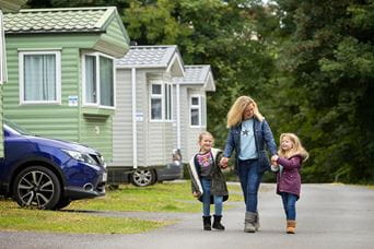Family next to caravans