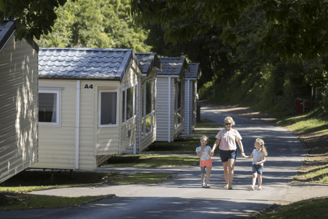 Family walking outside Torquay park homes