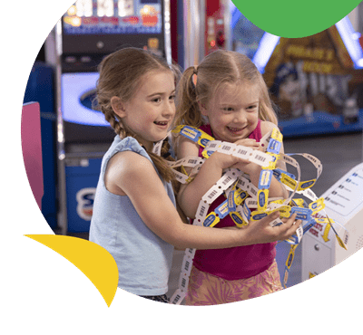 Two girls winning in the arcade at Torquay Holiday Park