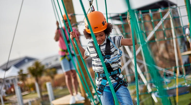 A family enjoying the high ropes at Trecco Bay