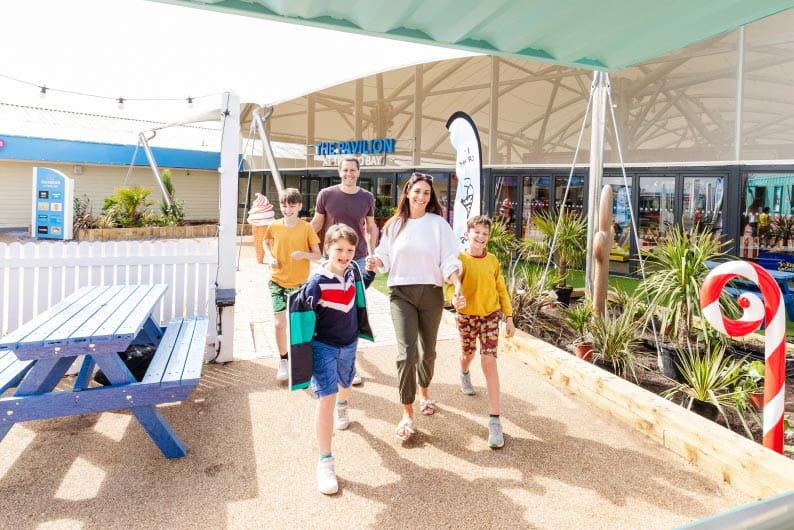 a family walking outside at Trecco Bay