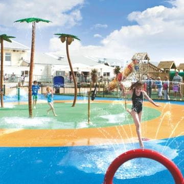 children playing in a splash park