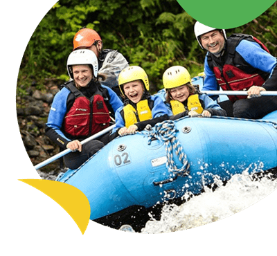 People on a white water raft at Nae Limits near Tummel Valley holiday park