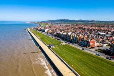 Busy residential, coastal town next to the sea