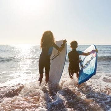 Two children surfing