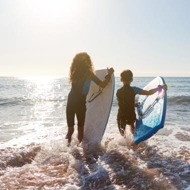 Two children surfing