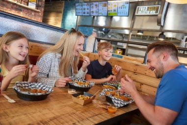 Family enjoying Thunderbird Chicken