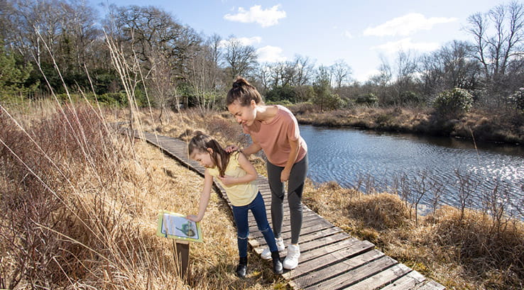 Two girls taking part on the nature trail at Warmwell