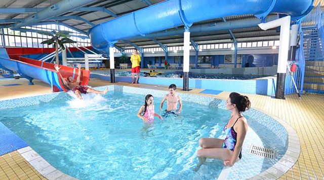 large swimming pool with water slides