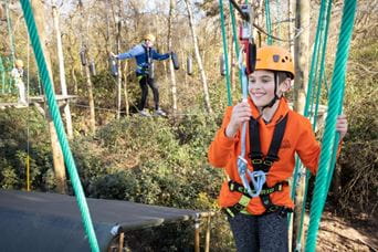 a child on the high ropes course
