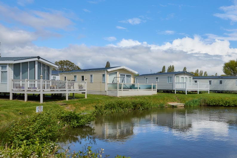 Caravans along the edge of a lake