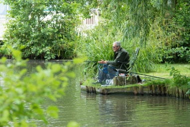a man fishing at a lake