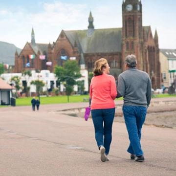 a couple walking around a country estate