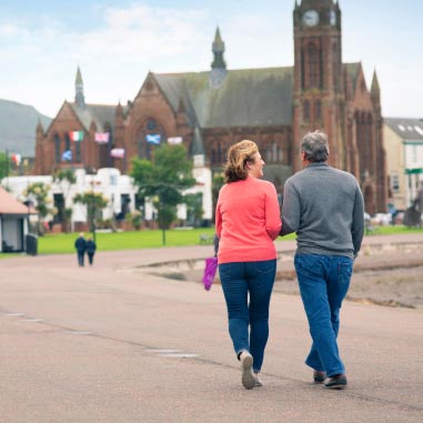a couple walking around a country estate