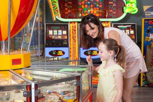 Mother and daughter playing amusement game