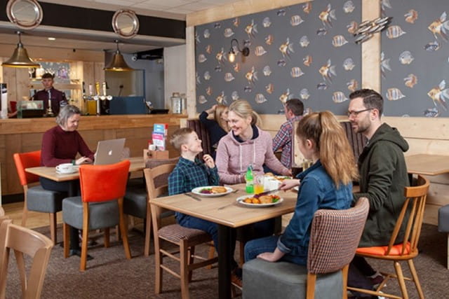 Family enjoying dinner at restaurant