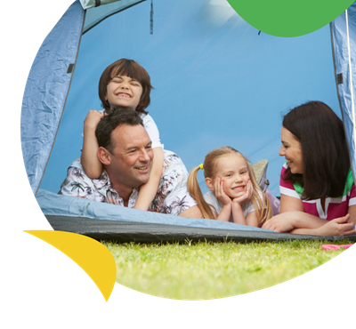 A family in a camping tent at West Bay Holiday Park