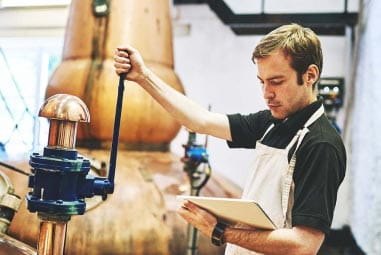 a man working in a brewery