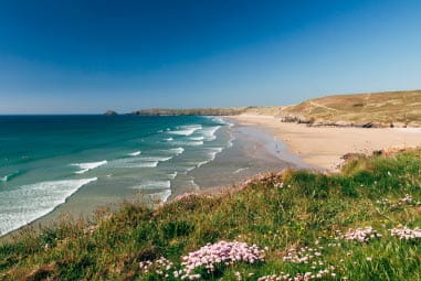 gentle waves rolling into Perranporth Beach in Cornwall