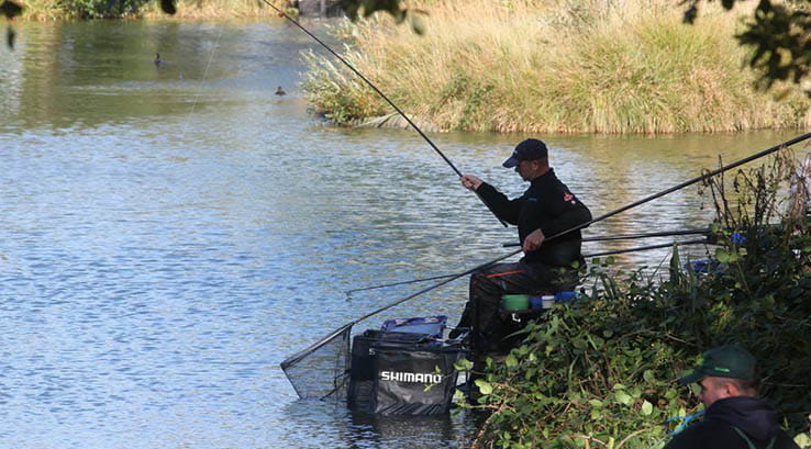 angler fishing on a lake