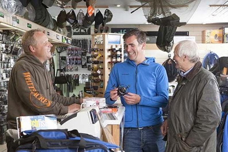 Men in fishing shop