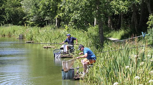 two anglers fishing on a lake