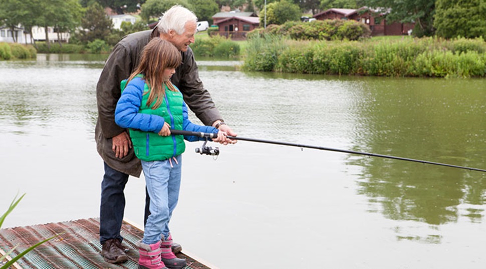 grandfather and granddaughter fishing