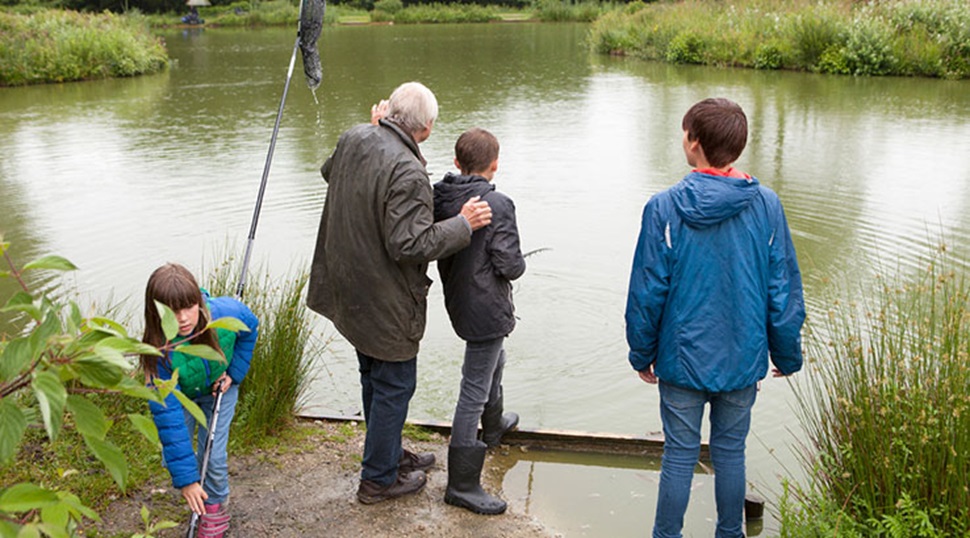grandfather and grandchildren fishing