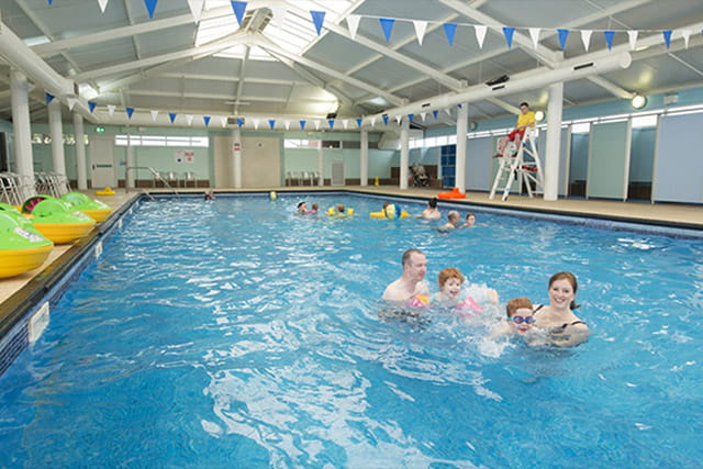 A family swimming in the indoor pool at Whitley Bay