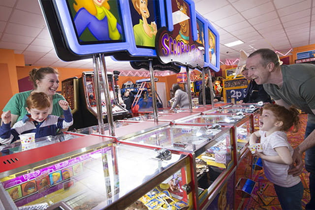 A family enjoying the amusement arcade