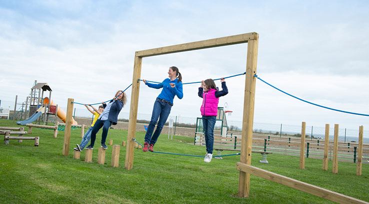 Kids playing on the adventure playground at Whitley Bay Holiday Park