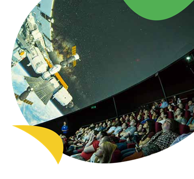 An audience watching an impressive space cinema at the Life Science Centre near Whitley Bay Holiday Park