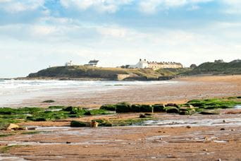 a picturesque bay with blue skies