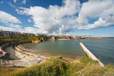 a panoramic view of a beach and the sea