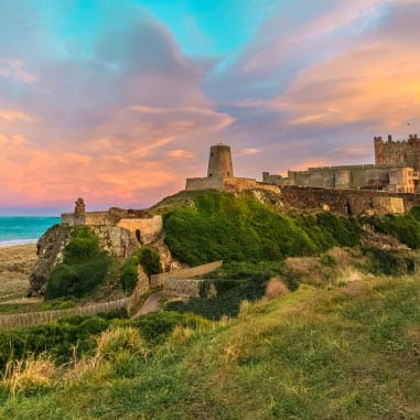 a castle set amongst green countryside