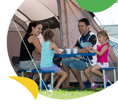 A family sat at a table in their tent at Withernsea Sands Holiday Park