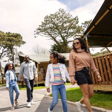 family walking by glamping tent