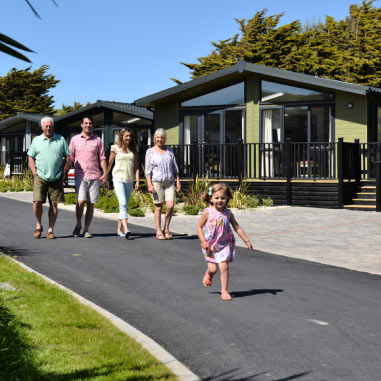 family walking by lodge
