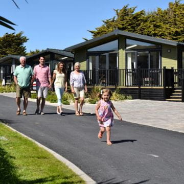 family walking by lodge