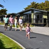 family walking by lodge