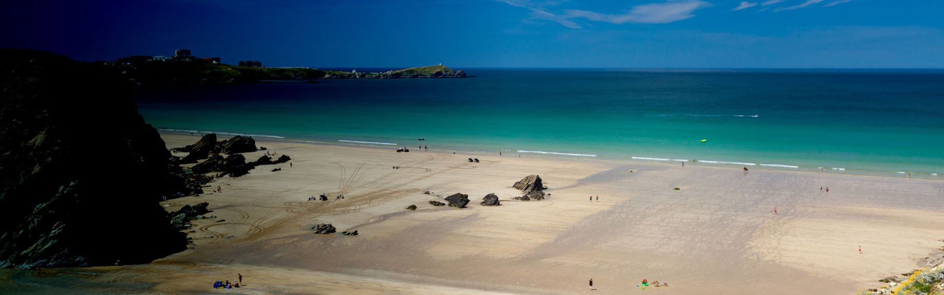 A view over a Cornwall beach on a hot and sunny day