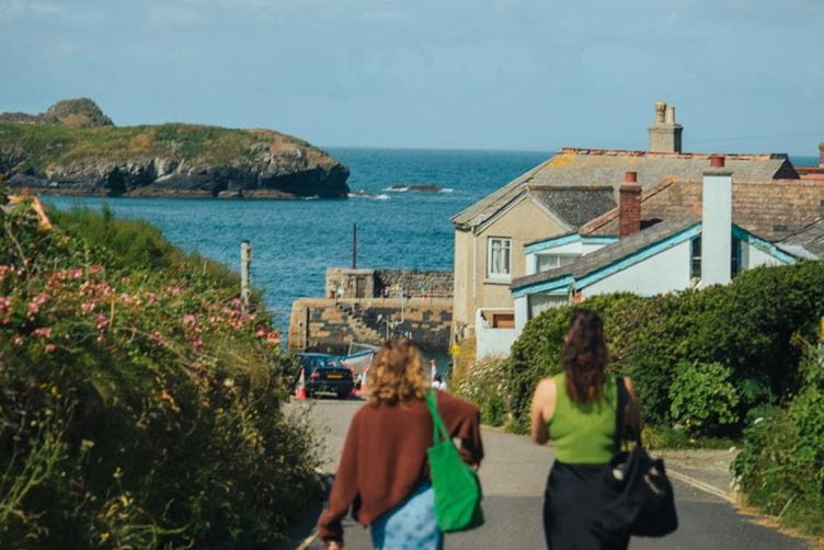 Couple walking towards the beach