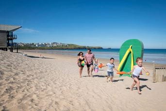 Family walking along the beach