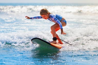 Girl on surfboard in Cornwall