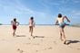 Children running on beach