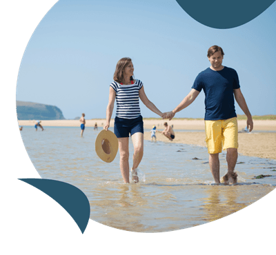 Couple walking along the beach