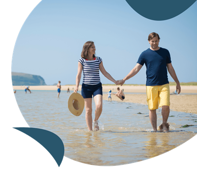 Couple walking along the beach